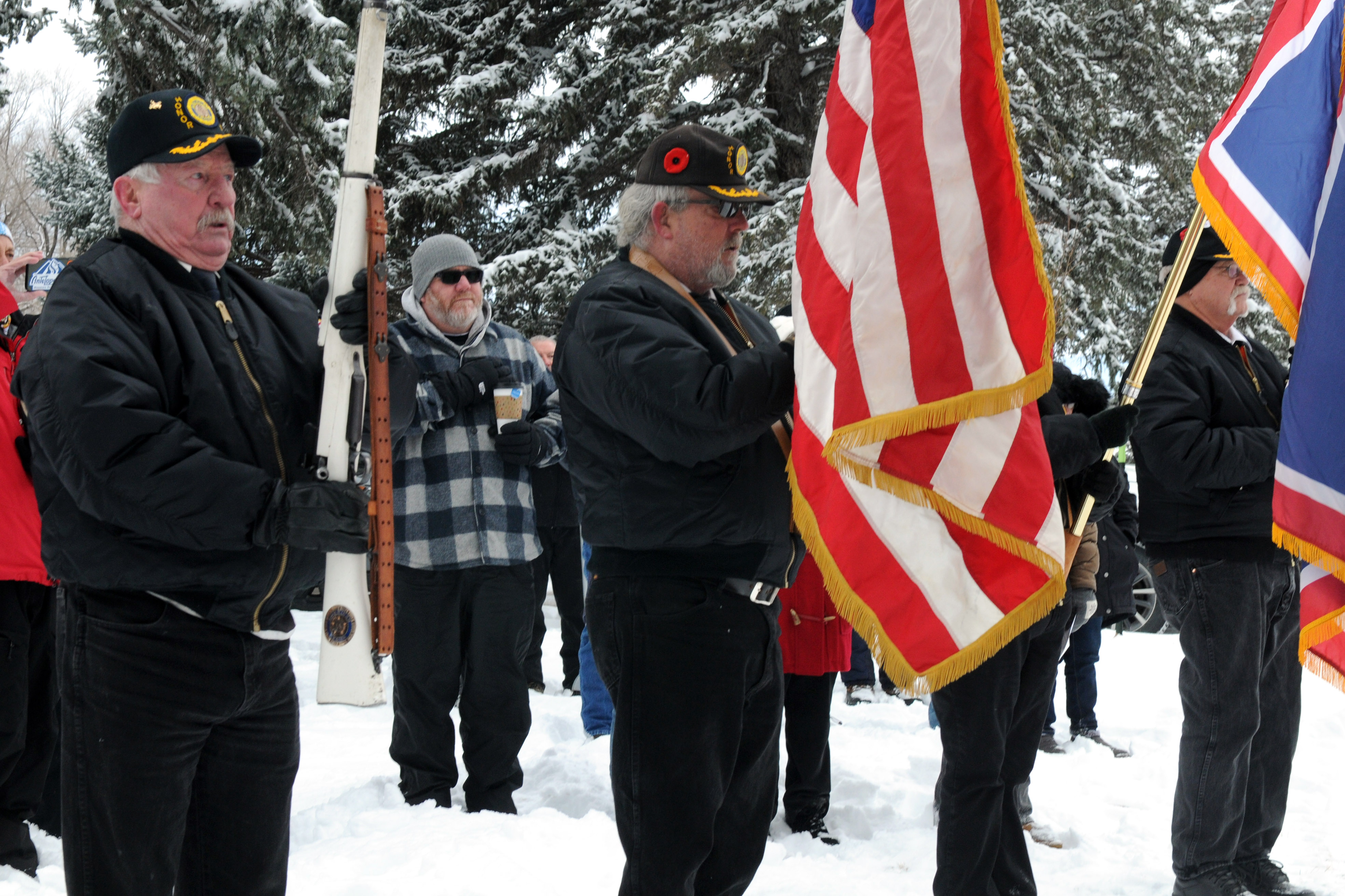 The American Legion Post No. 7 Color Guard present arms during the ceremony.