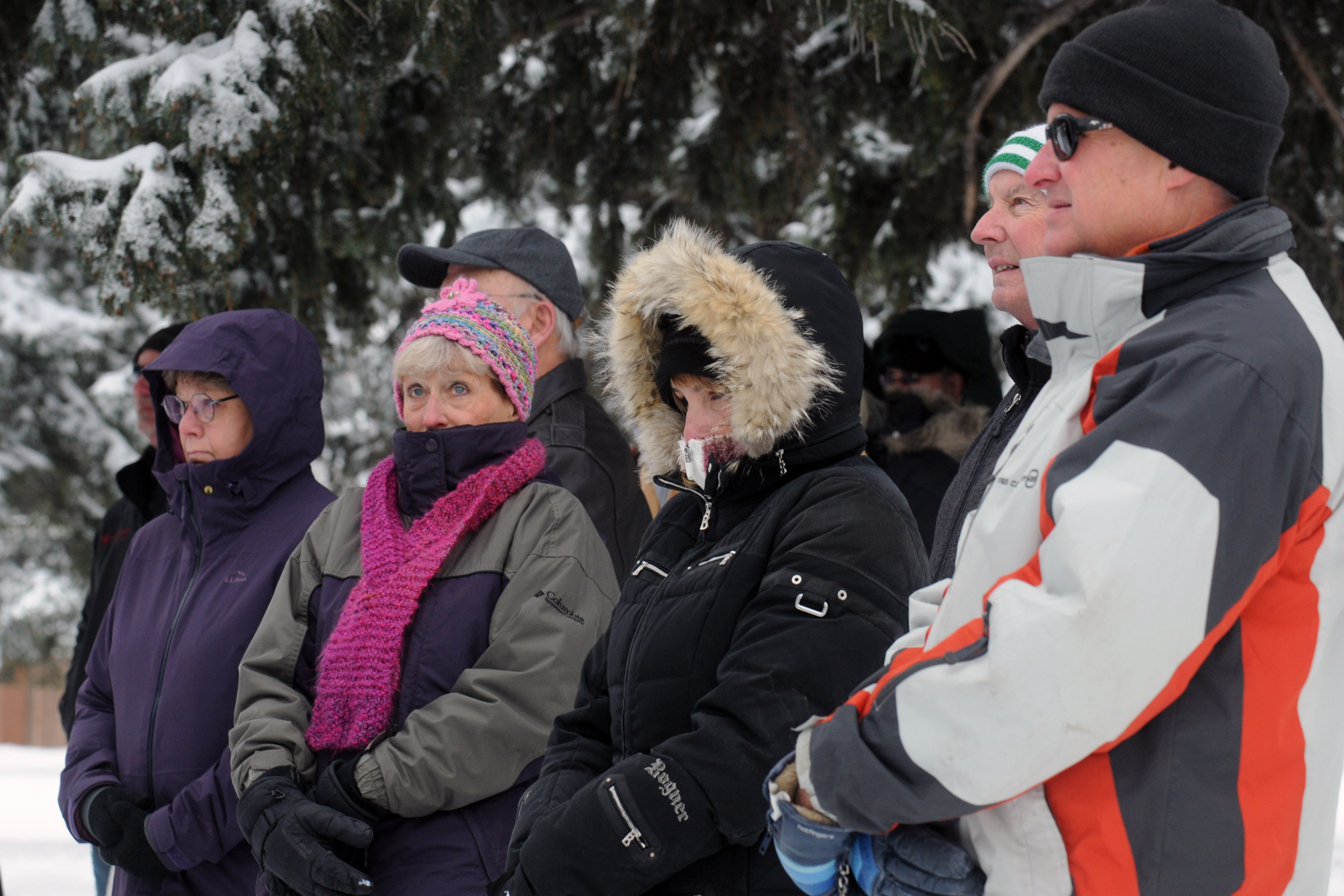 Sherida Nites bundle up to withstand the 16-degree temperature to attend the ceremony.