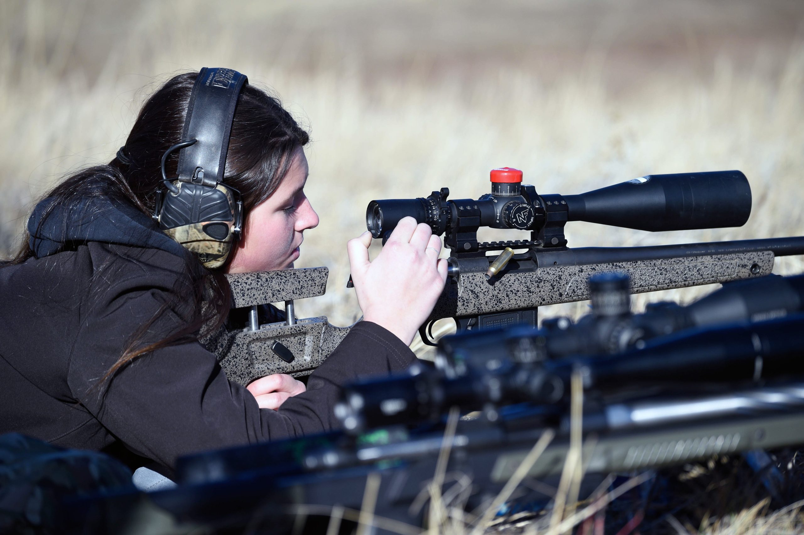 Lacy Hanson, Red Lodge, Mont., pulls the bolt back of her rifle to eject a spent cartridge during the Freeze Out 600 long range-rifle competition southeast of Sheridan Saturday, Jan. 3, 2026.