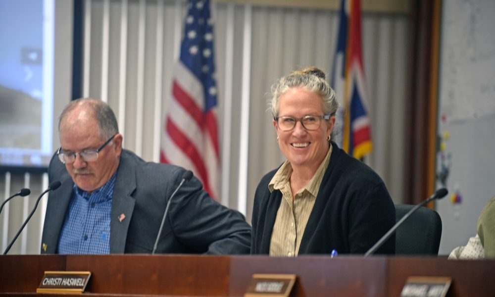 Christi Haswell smiles after being elected as the Sheridan County Board of County Commissioners Chairman at the first board meeting of the year Tuesday, Jan. 6, 2026. Lonnie Wright, left, was the chairman.