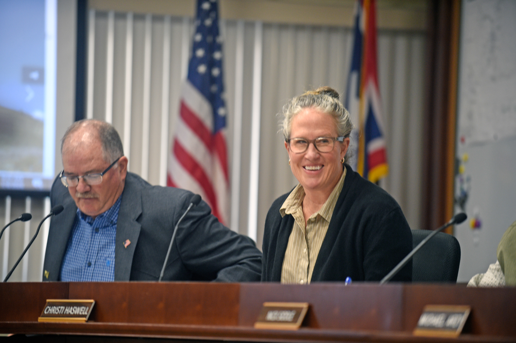 Christi Haswell smiles after being elected as the Sheridan County Board of County Commissioners Chairman at the first board meeting of the year Tuesday, Jan. 6, 2026. Lonnie Wright, left, was the chairman.