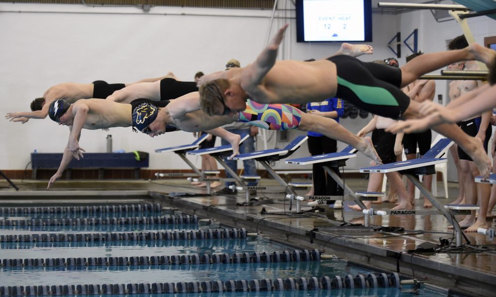 Sheridan Broncs' Ben Bujans, second from right, launches during the 400-meter freestyle relay.